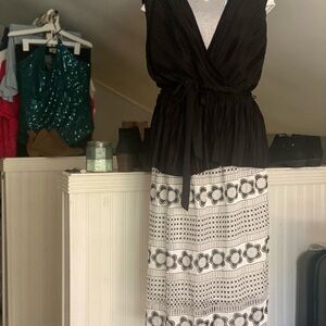 Super cute! Black , belted top! Looks so cute with jeans or skirts!